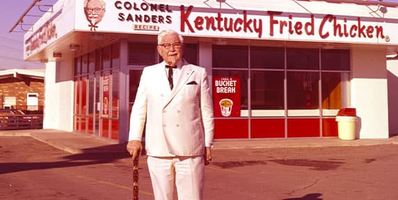 Colonel in front of a restaurant
